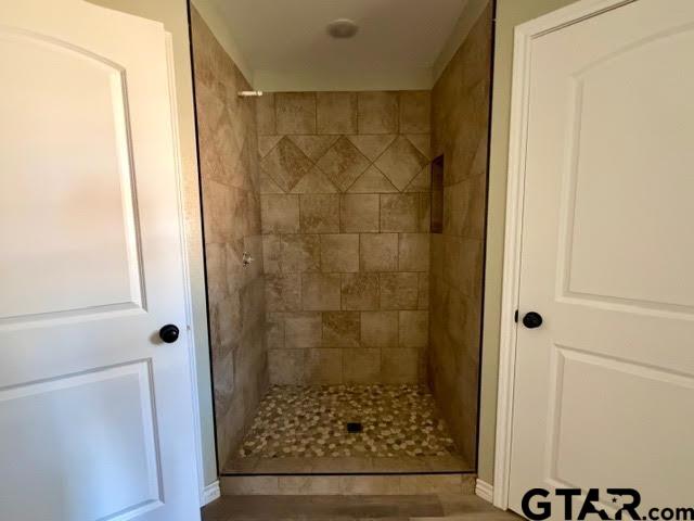 623 North Weldon Street Frankston, TX 75763 - Photo 19 of 29 a bathroom with a glass shower door