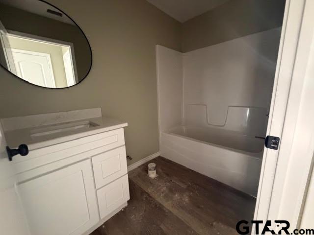 623 North Weldon Street Frankston, TX 75763 - Photo 24 of 29 a bathroom with a sink and a mirror
