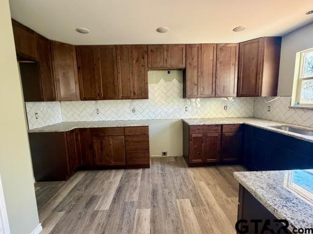 623 North Weldon Street Frankston, TX 75763 - Photo 29 of 29 a kitchen with a sink and wooden cabinets