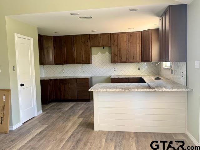 623 North Weldon Street Frankston, TX 75763 - Photo 5 of 29 a kitchen with a cabinets and a stove top oven