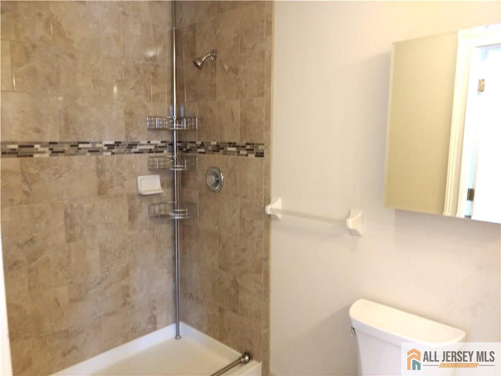 459 Main Street, Unit 1 Metuchen, NJ 08840 - Photo 16 of 21 a bathroom with a shower and a toilet