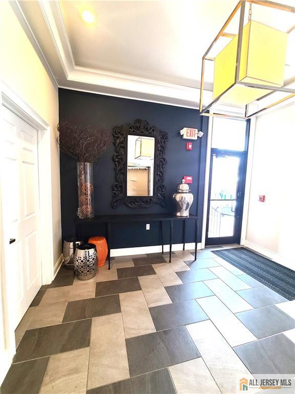 459 Main Street, Unit 1 Metuchen, NJ 08840 - Photo 3 of 21 a lobby with furniture and window