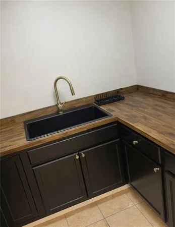 a close view of a stove top oven and cabinets
