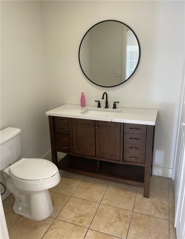 2676 Us-411 Highway Ranger, GA 30734 - Photo 9 of 9 a bathroom with a toilet a sink and mirror