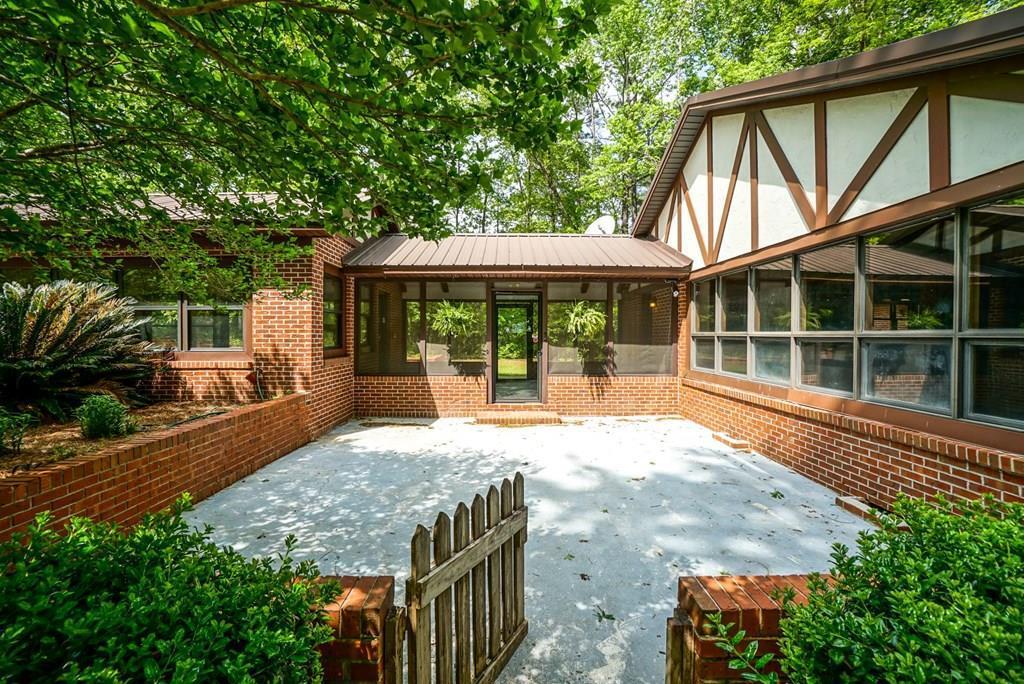 6875 Colaparchee Road, Unit 5A Macon, GA 31210 - Photo 2 of 39 a house view with a garden space