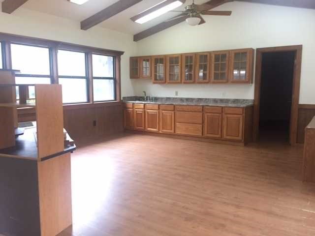 6875 Colaparchee Road, Unit 5A Macon, GA 31210 - Photo 11 of 39 a kitchen with stainless steel appliances granite countertop a stove a sink and a refrigerator