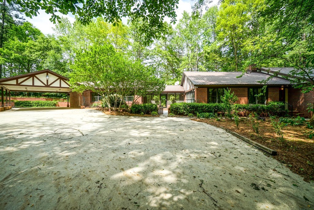 6875 Colaparchee Road, Unit 5A Macon, GA 31210 - Photo 18 of 39 a view of a house with a yard