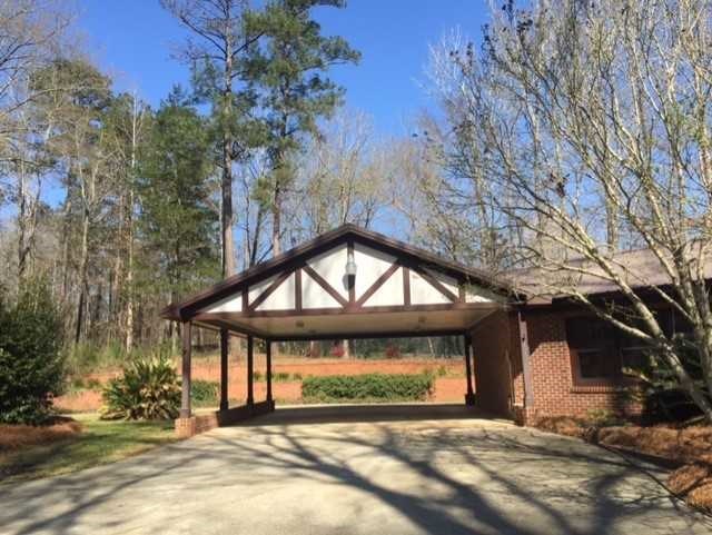 6875 Colaparchee Road, Unit 5A Macon, GA 31210 - Photo 20 of 39 a view of a house with a yard and a tree