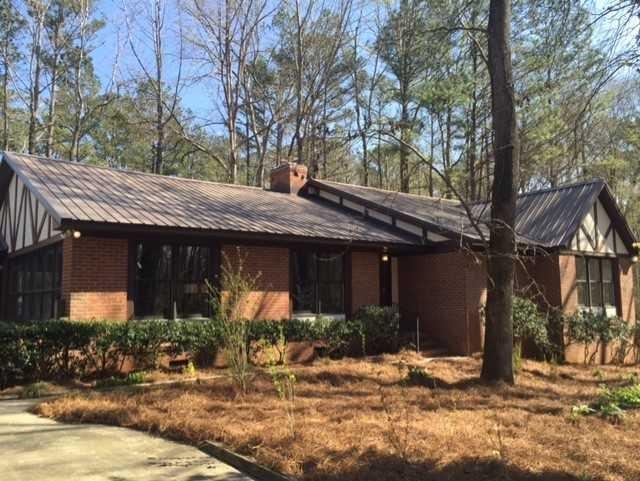 6875 Colaparchee Road, Unit 5A Macon, GA 31210 - Photo 3 of 39 a view of a house with brick walls and a tree