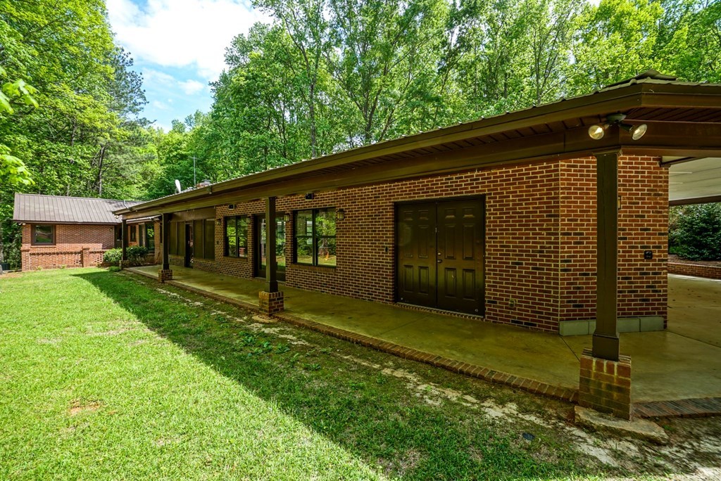 6875 Colaparchee Road, Unit 5A Macon, GA 31210 - Photo 21 of 39 a front view of a house with garden