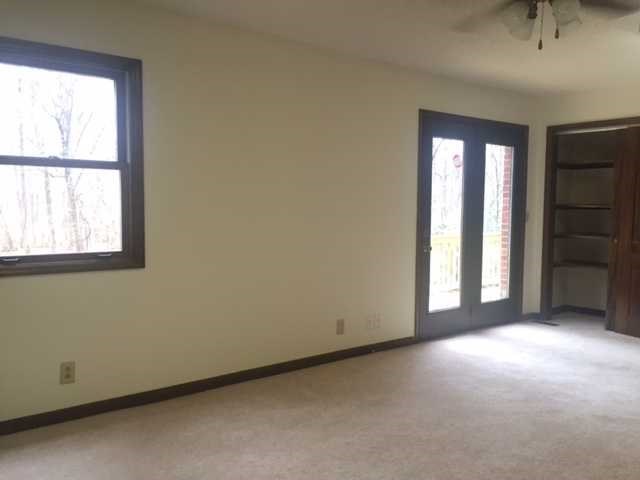 6875 Colaparchee Road, Unit 5A Macon, GA 31210 - Photo 28 of 39 an empty room with windows