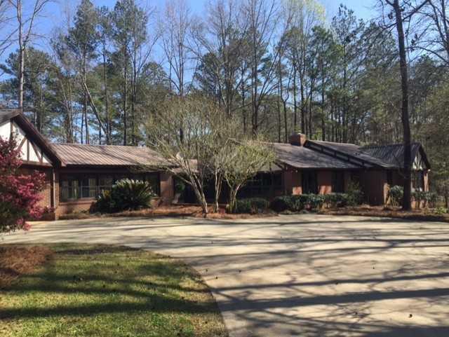 6875 Colaparchee Road, Unit 5A Macon, GA 31210 - Photo 9 of 39 a outdoor view of a building with a garden