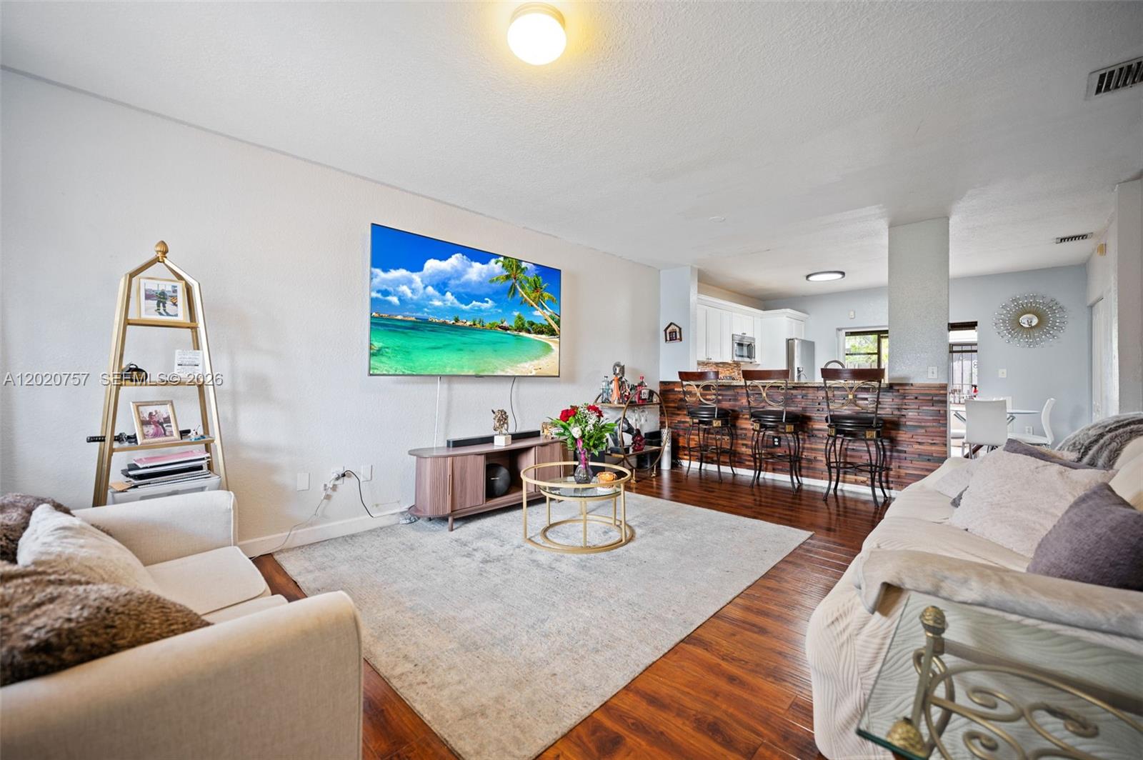 255 East 3rd Street, Unit 1 Hialeah, FL 33010 - Photo 9 of 38 a living room with furniture and wooden floor