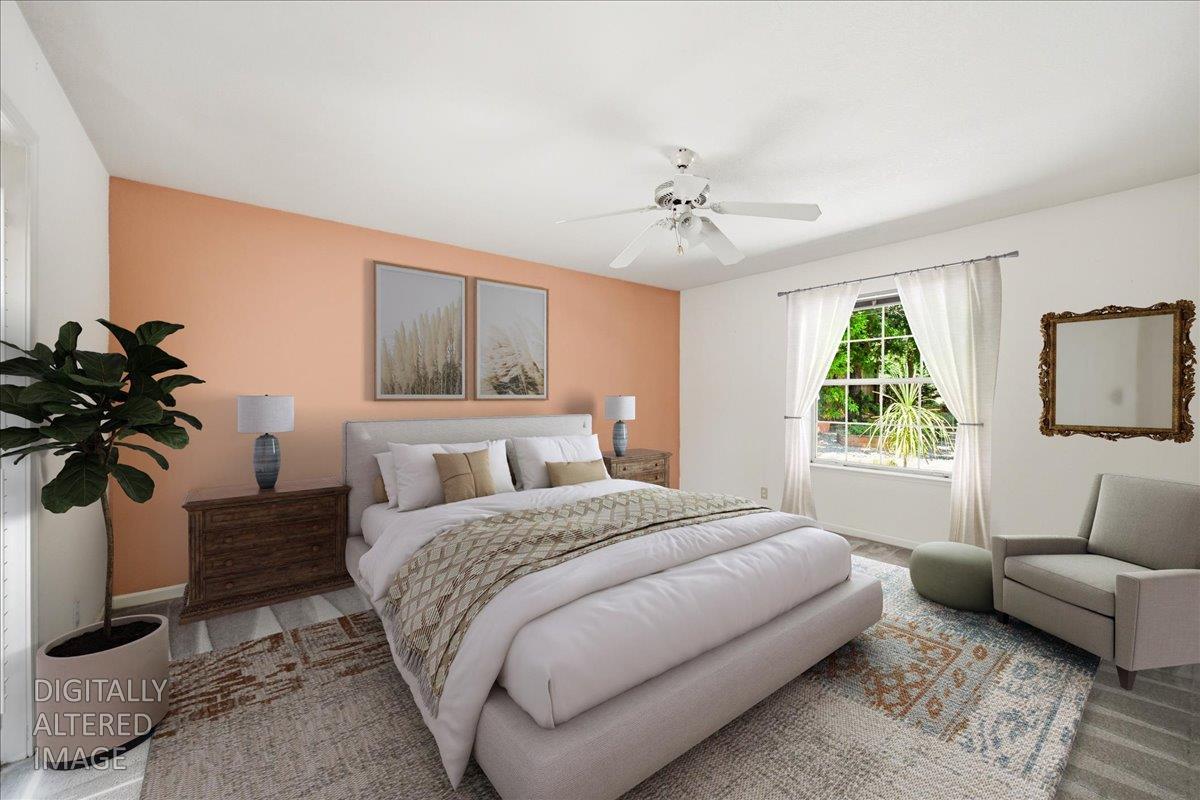 12600 Friar Tuck Road Grass Valley, CA 95949 - Photo 16 of 56 a bedroom with a bed a couch and a window