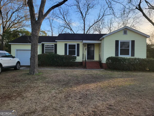 a house view with a garden space