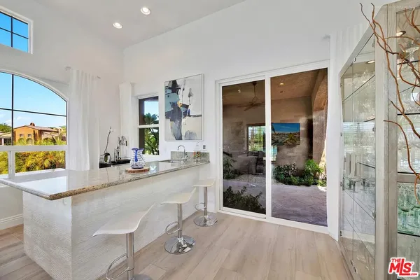 a room with sink and glass door