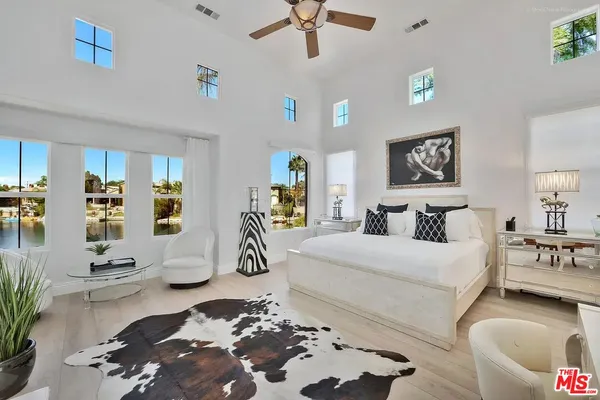 a bedroom with a bed and a couch