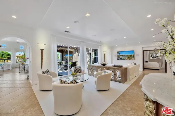 a living room with furniture and a table