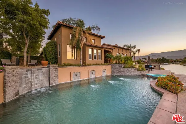 a view of a swimming pool with a lake view