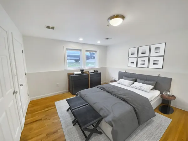 a bed room with a bed and a cabinets