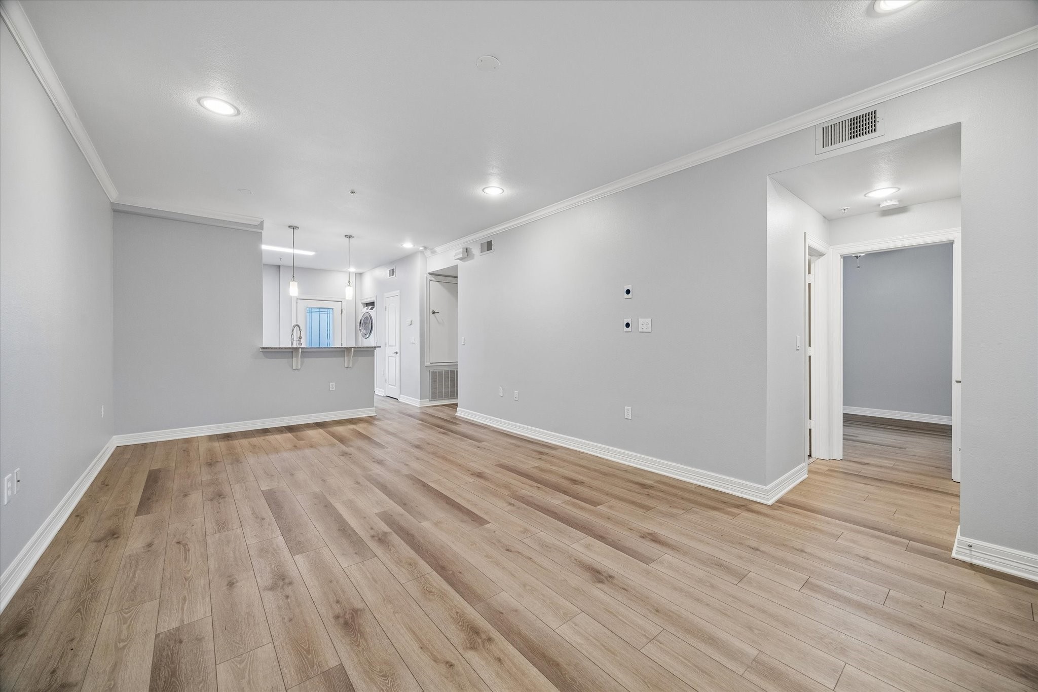 3501 Chenevert Street, Unit 7 Houston, TX 77004 - Photo 5 of 21 Fresh paint and updated engineered hardware floors.