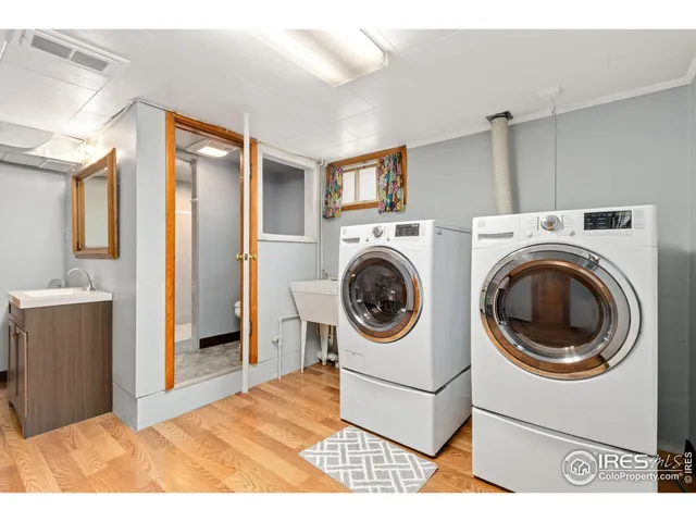 a view of a hallway with washer and dryer