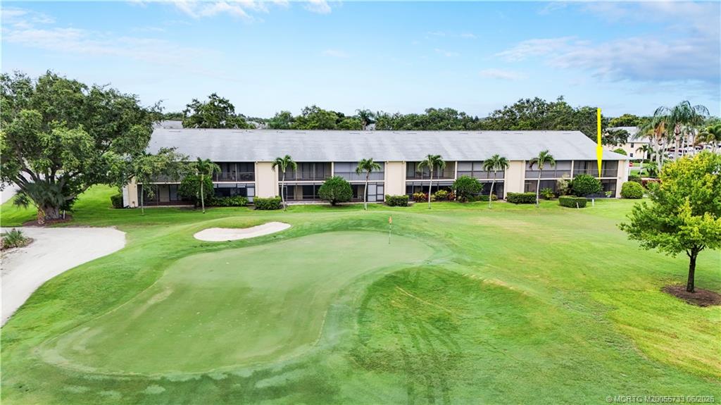1001 Keystone Drive, Unit A Jupiter, FL 33458 - Photo 23 of 30 a view of a house with a garden and houses