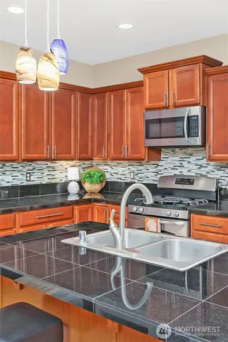 a backyard of a house with table and chairs