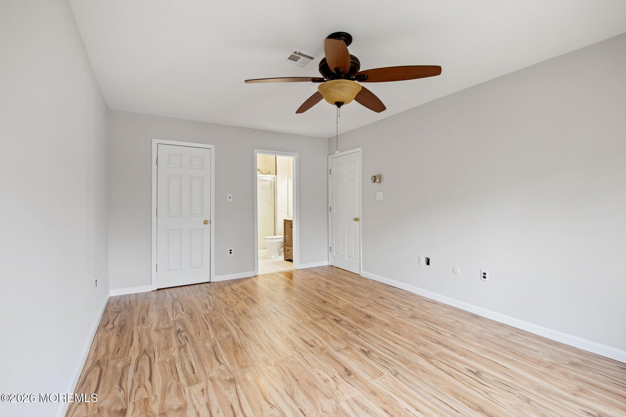 102 Arrowood Road, Unit B Manalapan, NJ 07726 - Photo 25 of 41 a view of empty room with wooden floor
