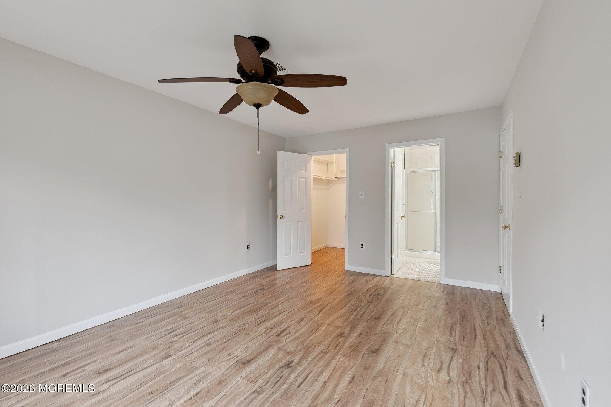 102 Arrowood Road, Unit B Manalapan, NJ 07726 - Photo 27 of 41 a view of empty room with wooden floor
