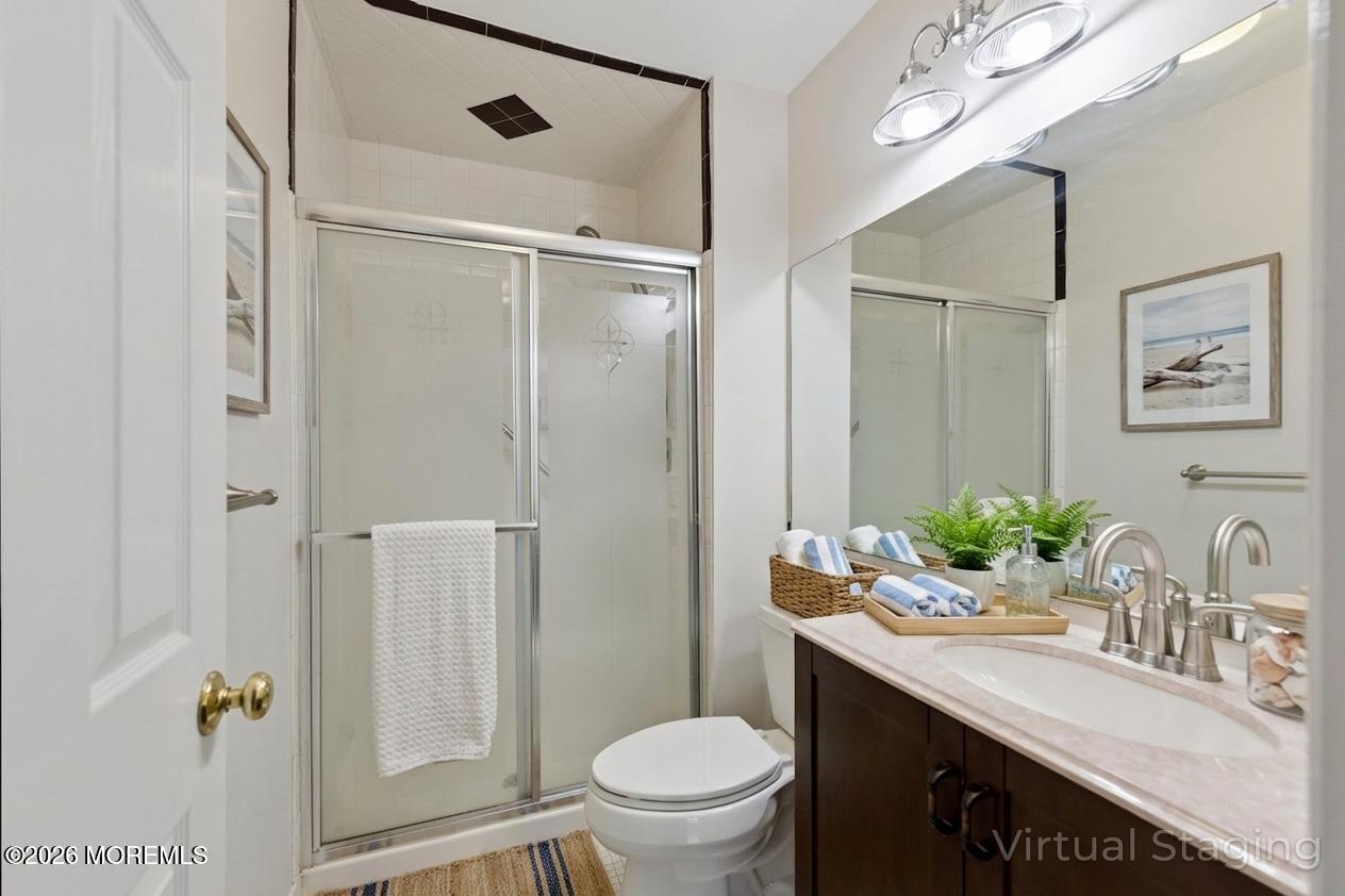 102 Arrowood Road, Unit B Manalapan, NJ 07726 - Photo 29 of 41 a bathroom with a granite countertop sink toilet and shower