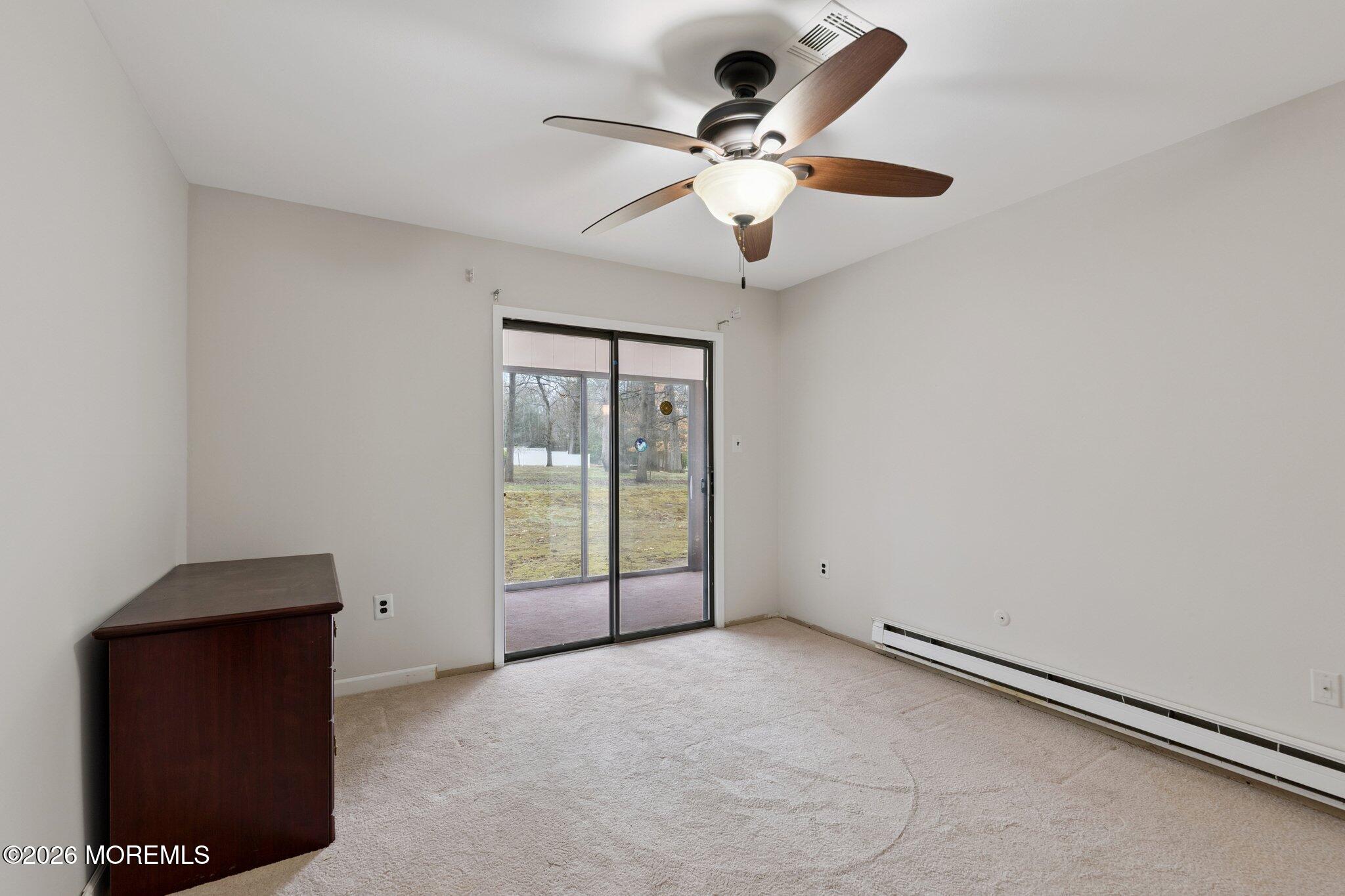 102 Arrowood Road, Unit B Manalapan, NJ 07726 - Photo 34 of 41 a view of an empty room with a window