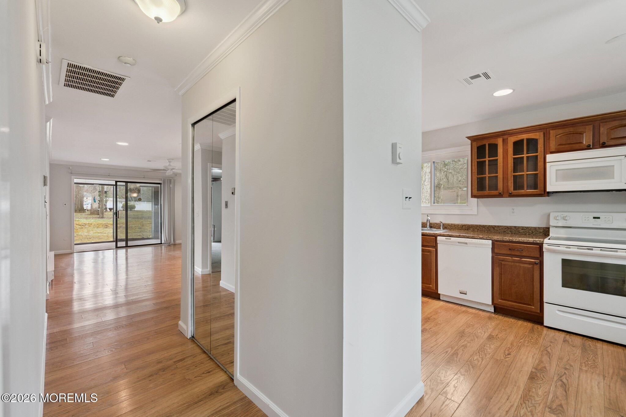 102 Arrowood Road, Unit B Manalapan, NJ 07726 - Photo 6 of 41 a view of a kitchen cabinets and wooden floor