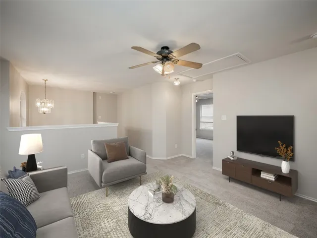 a bedroom with a large bed and a potted plant