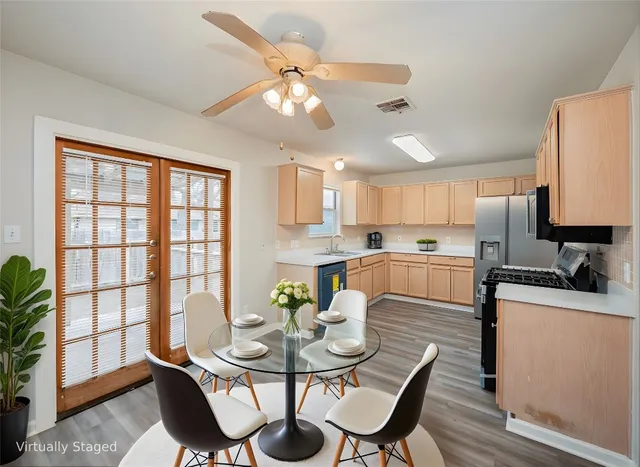 a view of a dining room with furniture and wooden floor