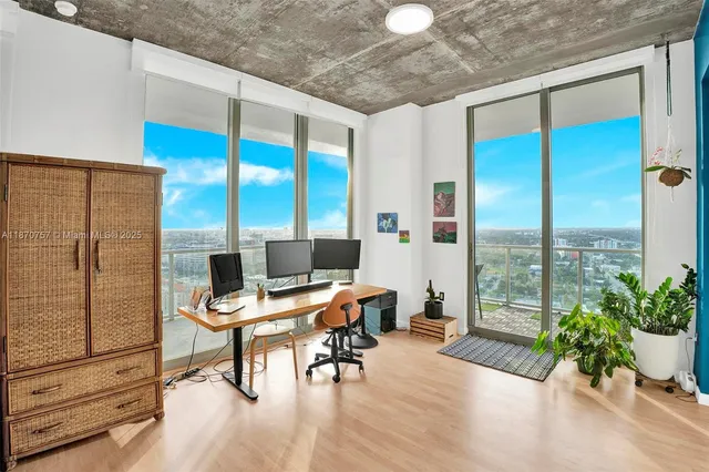 a workspace with furniture and window