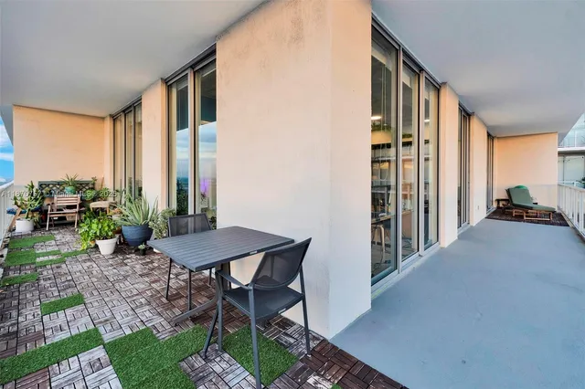 a view of a swimming pool with a lounge chairs