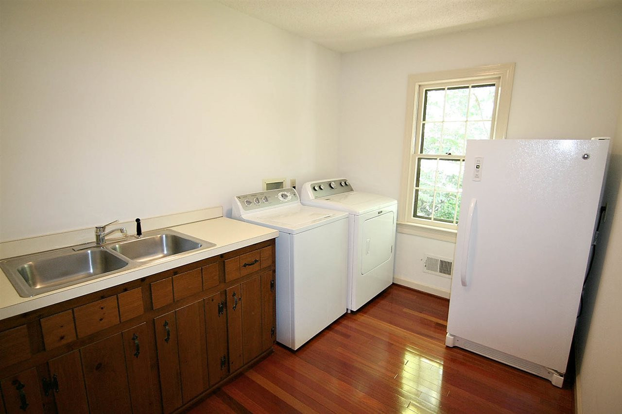 8005 Shellnut Road Raleigh, NC 27615 - Photo 13 of 25 Best Room in the House. Oversized Laundry Room has a Double Utility Sink and offers Plenty of Room for Whatever You need to store. Laundry
