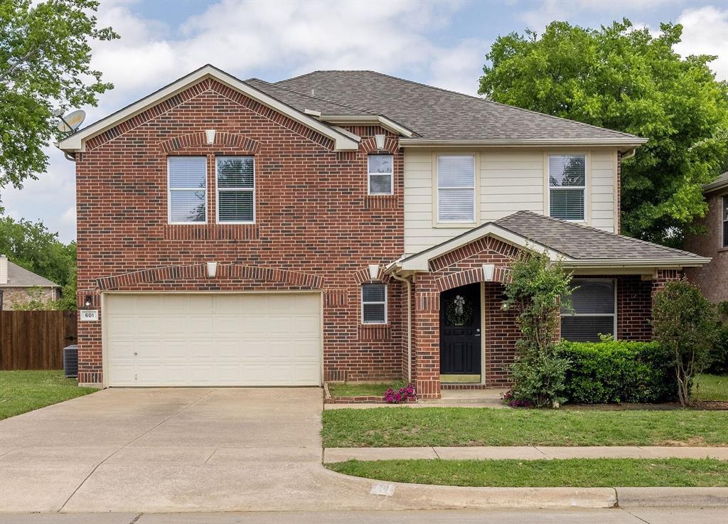 601 Amy Way Euless, TX 76039 - Photo 1 of 40 a front view of a house with a yard and garage