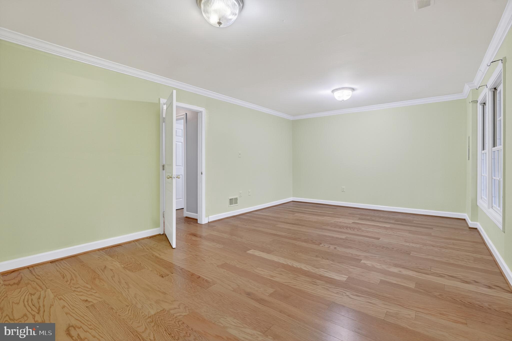 6319 Powder Flask Court Centreville, VA 20121 - Photo 11 of 31 wooden floor in an empty room with a window
