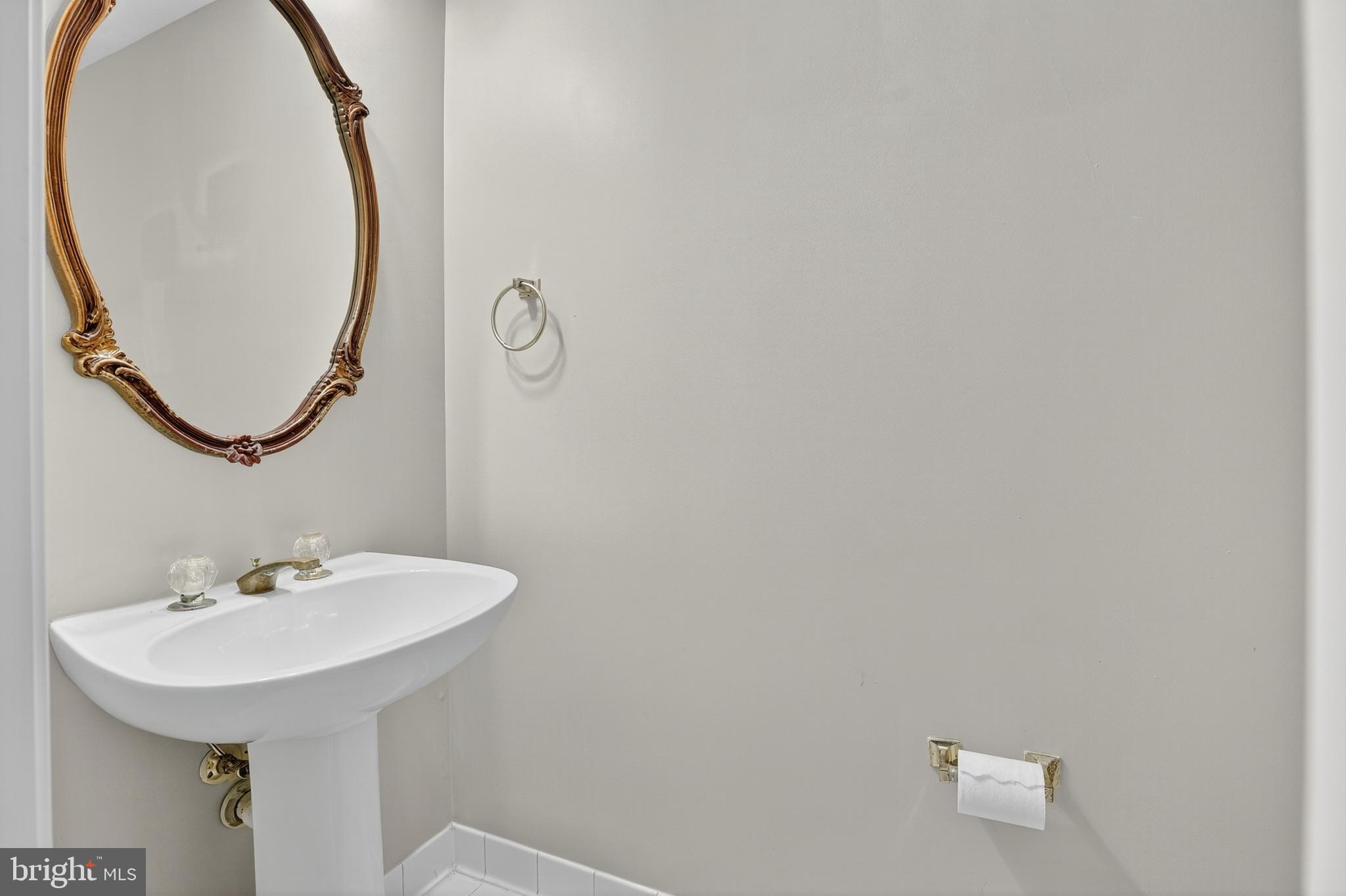 6319 Powder Flask Court Centreville, VA 20121 - Photo 13 of 31 a bathroom with a sink and a mirror