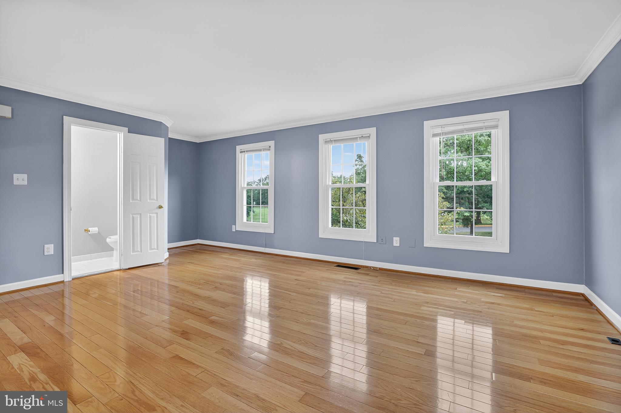 6319 Powder Flask Court Centreville, VA 20121 - Photo 14 of 31 a view of an empty room with wooden floor and a window