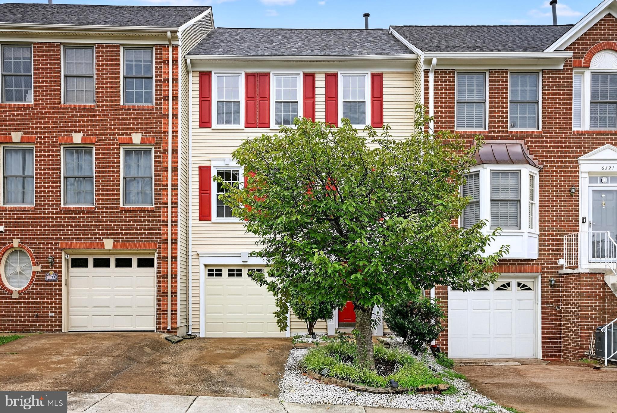 6319 Powder Flask Court Centreville, VA 20121 - Photo 2 of 31 a front view of a building with garden