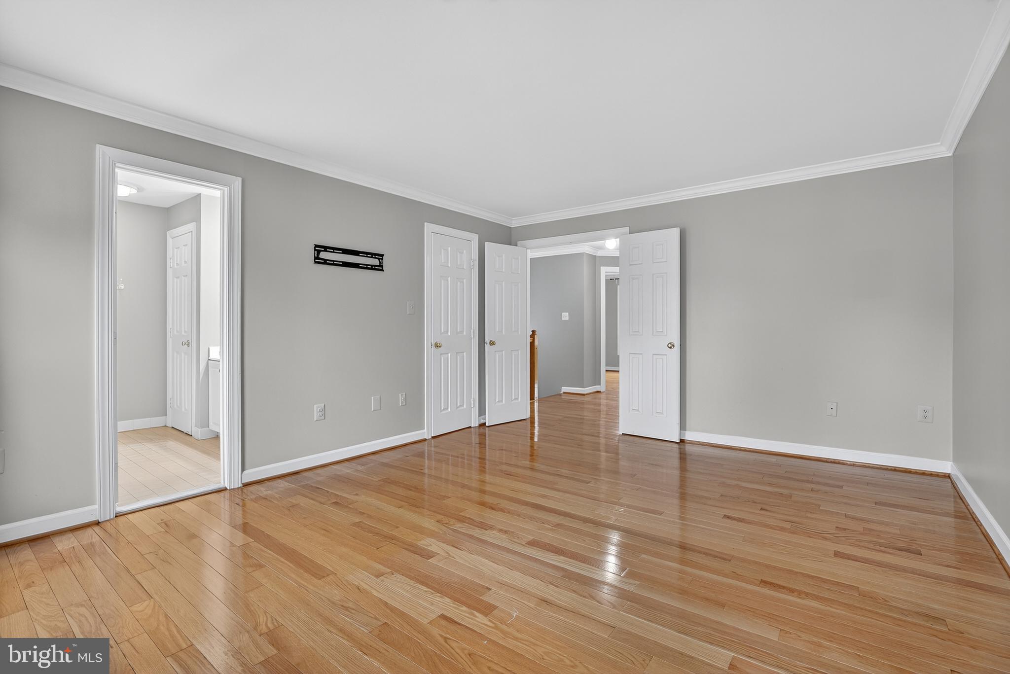 6319 Powder Flask Court Centreville, VA 20121 - Photo 26 of 31 a view of an empty room with wooden floor and a window