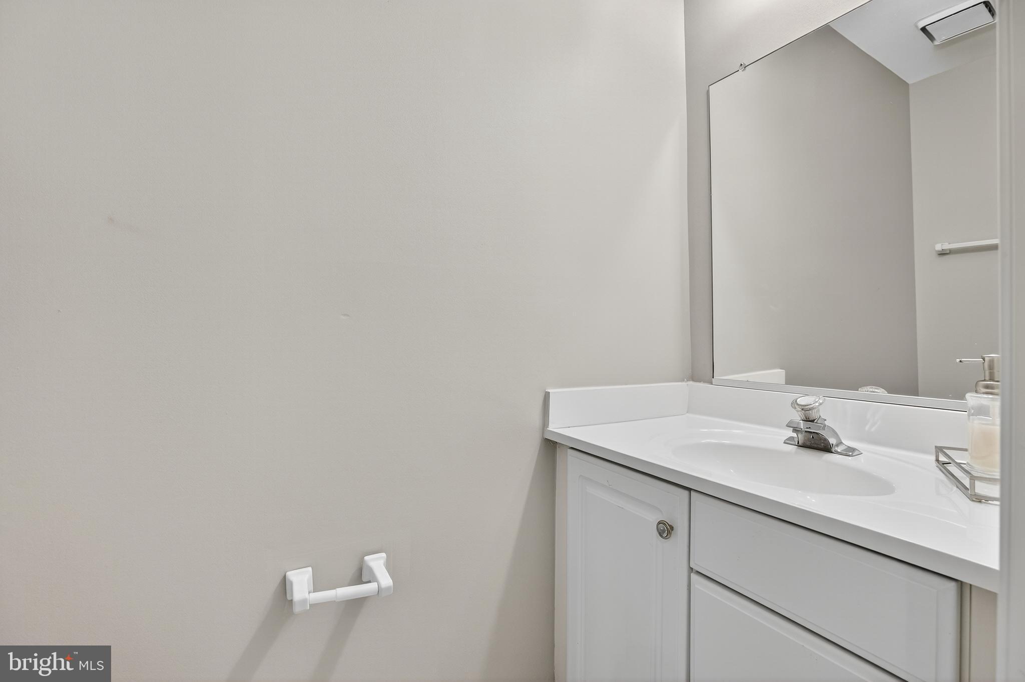 6319 Powder Flask Court Centreville, VA 20121 - Photo 6 of 31 a bathroom with a sink and a mirror