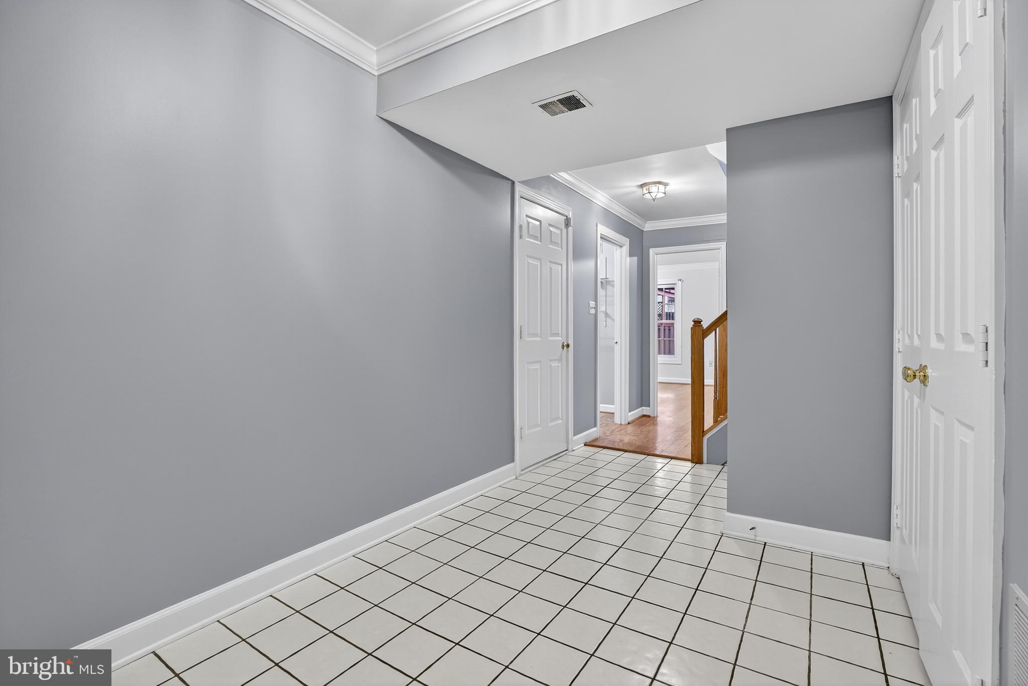 6319 Powder Flask Court Centreville, VA 20121 - Photo 7 of 31 a view of a hallway with wooden floor