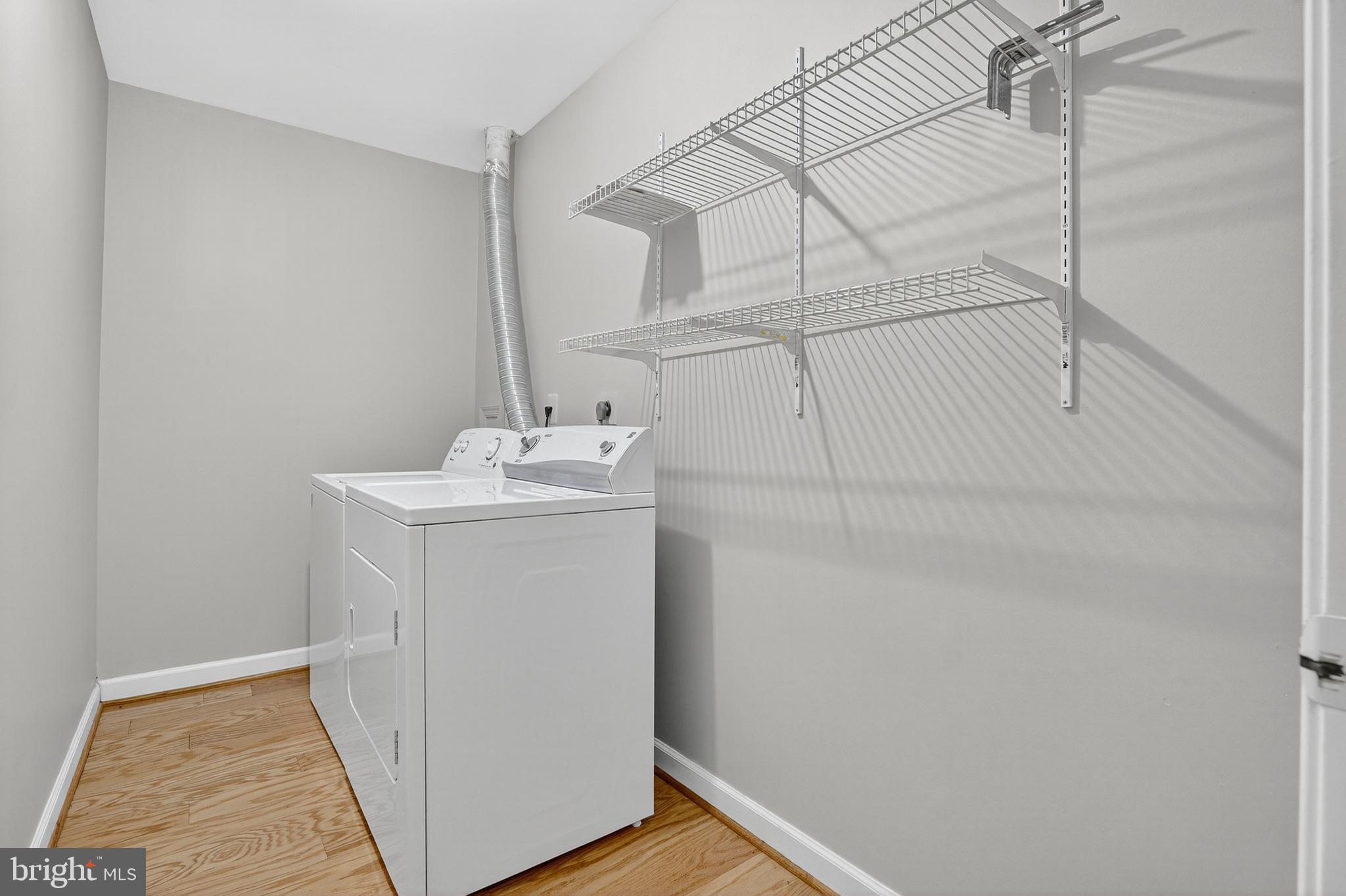 6319 Powder Flask Court Centreville, VA 20121 - Photo 9 of 31 a utility room with dryer and washer
