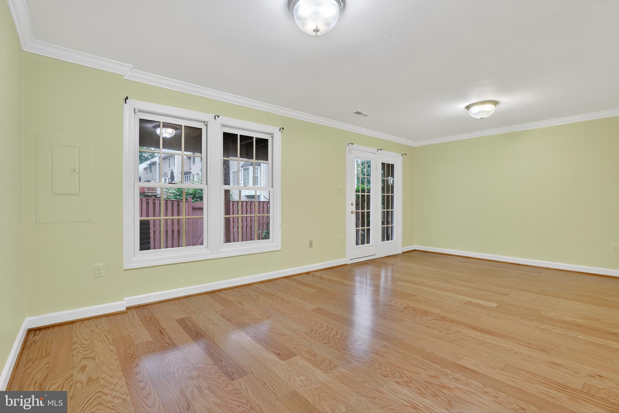 6319 Powder Flask Court Centreville, VA 20121 - Photo 10 of 31 a view of an empty room with wooden floor and a window
