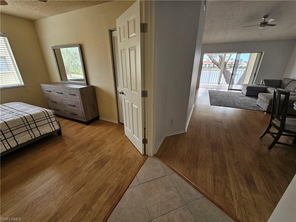 7766 Emerald Circle, Unit R201 Naples, FL 34109 - Photo 18 of 35 a view of a livingroom with furniture and a window