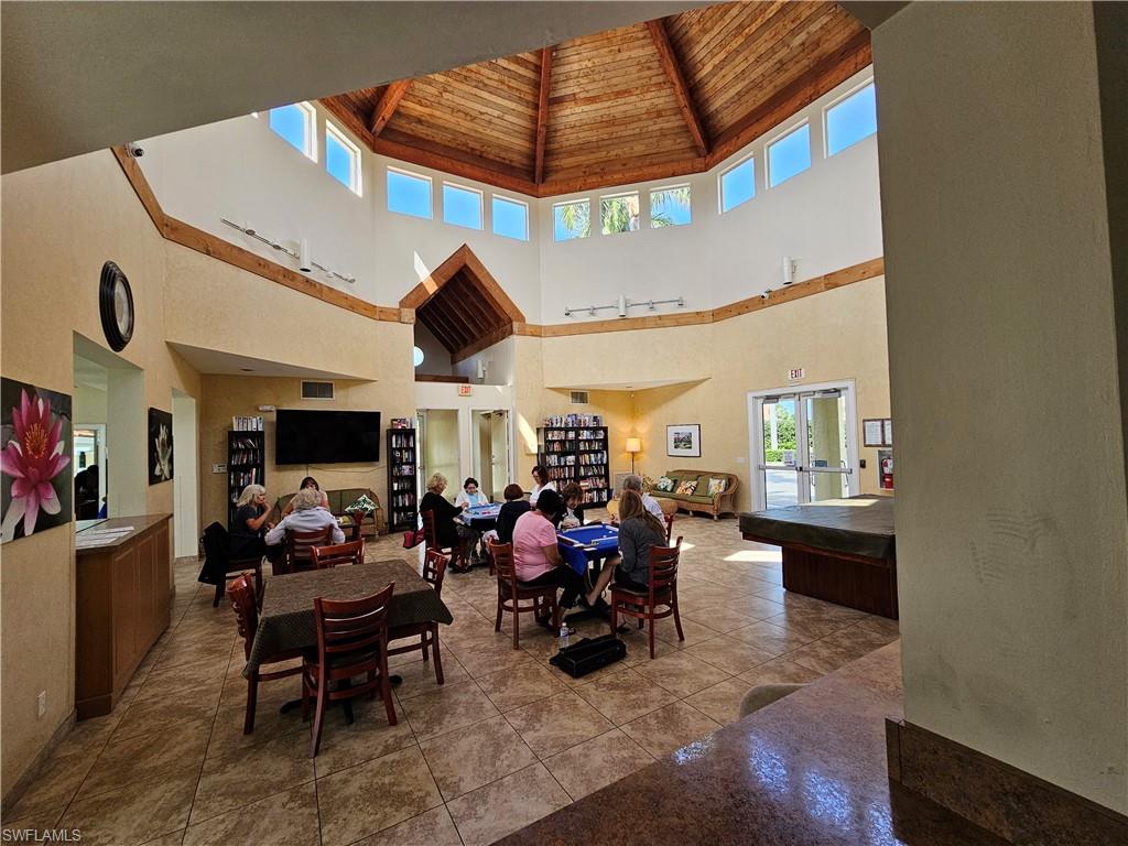 7766 Emerald Circle, Unit R201 Naples, FL 34109 - Photo 32 of 35 a view of a livingroom with furniture and a rug
